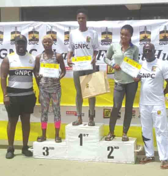 Kate Agyeman (middle) displaying her certificate 