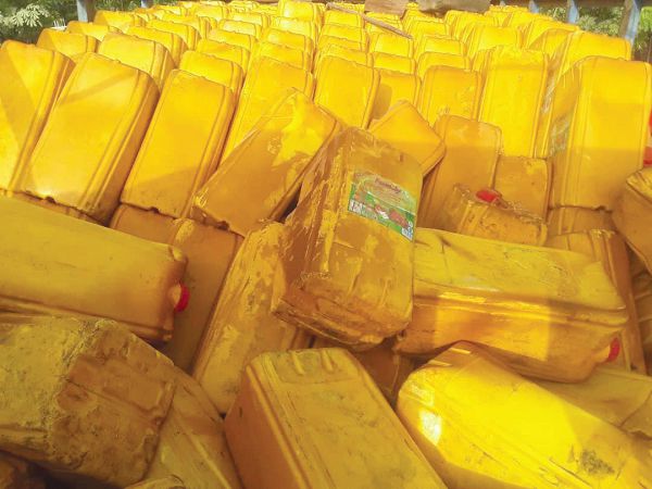Some of the gallons of cooking oil suspected to have been smuggled from Togo