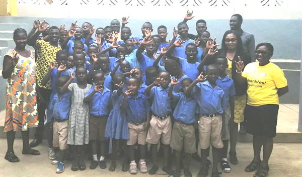 Madam Genevieve Basigha (arrowed), the Proprietress of the school, with some pupils and staff. Behind her is Mr Agyemang Prempeh, the Headmaster of the school Picture: Kwadwo Baffoe Donkor