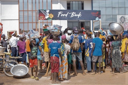 People queueing to receive their foods packs