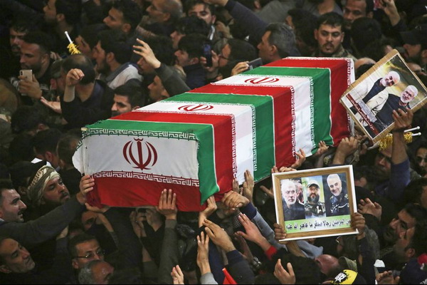 Huge crowds at funeral for Iran commander