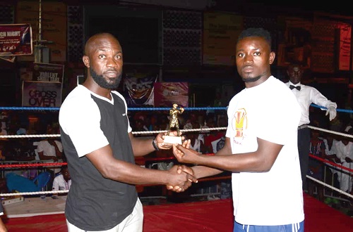 Norbert Abungaje (right) receiving his award from Mr Mike Sowah