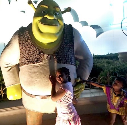 Eno poses with Shrek at Dreamworks in Dubai