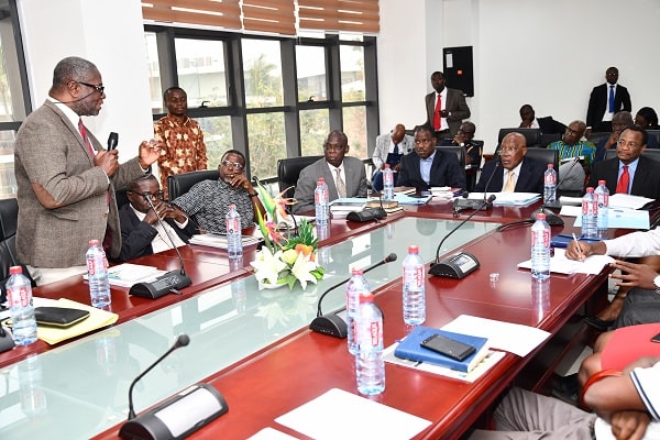 Mr E. Kwasi Okoh (left), the Managing Director of Aluworks Limited, presenting the company’s case to the commission. Picture: EBOW HANSON