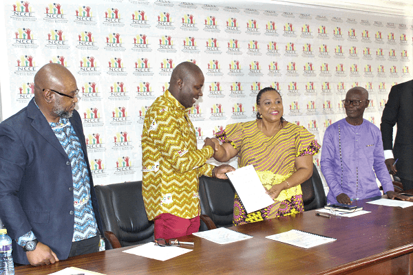  Dr Ibrahim Anyars (2nd left), and Ms Josephine Nkrumah (2nd right) exchanging the document after signing the MoU. With them are Mr Samuel Asare Akuamoah (right), Deputy Chair of NCCE, and Mr Mubarak Bowan (left), the Director of Business, Research and Skills Development of NABCO.  Picture: LYDIA ESSEL-MENSAH