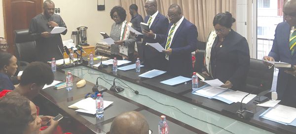 Dr Matthew Opoku Prempeh, the Minister of Education swearing in members of the CIB Governing Board