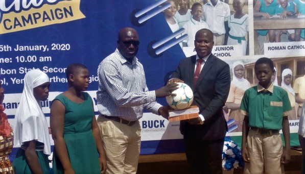  Mr Mohammed Habibu Tijani (right) making a presentation to one of the beneficiary schools
