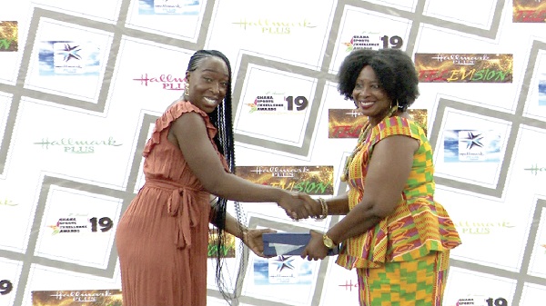 Jeanette Kwakye (left) receiving an award from Ms Florence Boateng