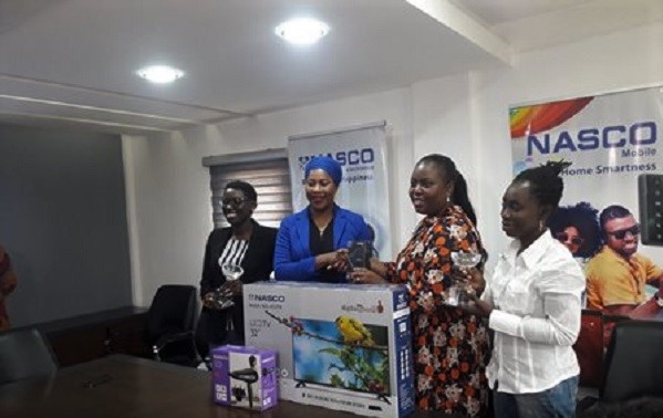 Mrs Adiza Ibrahim Sadick (second left) presenting the items to Mrs Hillary Boaten