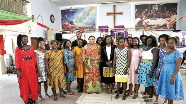 The First Lady Mrs Rebecca Akufo-Addo (middle) with some of the women and officials of NBSSI and Dr Bernard Okoe Boye (arrowed), MP for Ledzokuku Constituency
