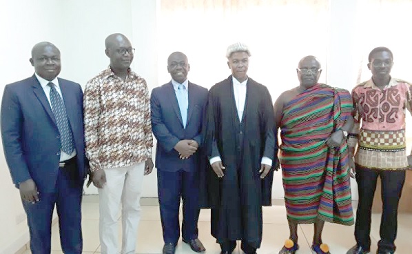 The board members with Justice Kofi Akrowiah