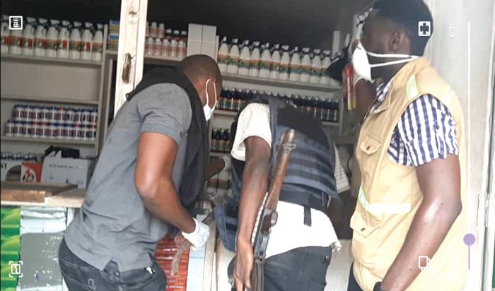  The combined team retrieving some illegal chemicals from a shop at Odorkor