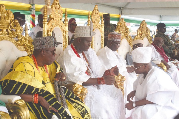 Oba Adeyeye Enitan Ogunwusi Ojaja II (2nd left), the Ooni of Ife, performing the conferment rites on Dr Ahmed Vanderpuije (right), the Balogun of Yoruba, Ghana. With them is Vice-President Dr Mahamudu Bawumia (3rd left).