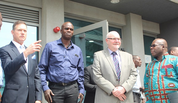 Mr Ross Ridenoure (left), a Nuclear Power Consultant, expressing a point to some of the officials after the meeting. Those in the picture include  Mr Theo Nii Okai (far right), Executive Director of Nuclear Power Ghana, Mr Samuel Odartey Lamptey (2nd left), Project Manager of Nuclear Power Ghana and Mr Neil Ivison (2nd right), Director of Ivison Quality Consulting Limited.