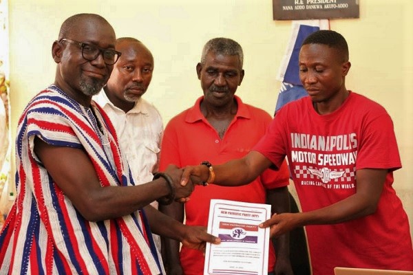 Nana Fredua Agyeman Ofori-Atta being handed over the nomination forms by the constituency Secretary, Mr Nii-Kortey Quaye