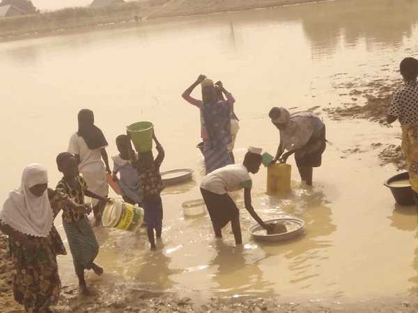 Some residents fetching polluted water from the dam