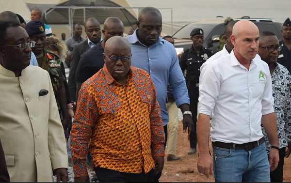 President Akufo-Addo, accompanied by Dr Owusu Afriyie Akoto (left), being conducted round the village by Mr Ofer Tamir (2nd right), the General Manager of AGRITOP Limited