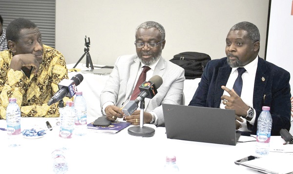 Dr John Amuasi (right), making a presentation on snake bites at the media briefing. With him are Dr Anthony Nsiah-Asare (middle) and Dr Benjamin Aboagye Marfo
