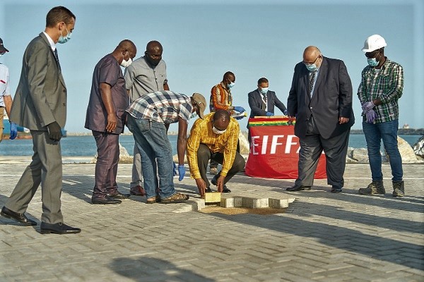  Mr Alan Kyerematen laying a block at the MPS Terminal Three. Those looking on include Mr Mohammed Samara (2nd right) and Mr Daniel Titus-Glover (3rd left)
