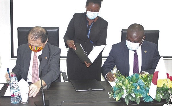  Mr Tsutomu Himeno (left), Japanese Ambassador to Ghana, and Mr Charles Owiredu (right), Deputy Minister of Foreign Affairs and Regional Integration, signing the agreement in Accra. Picture: GABRIEL AHIABOR