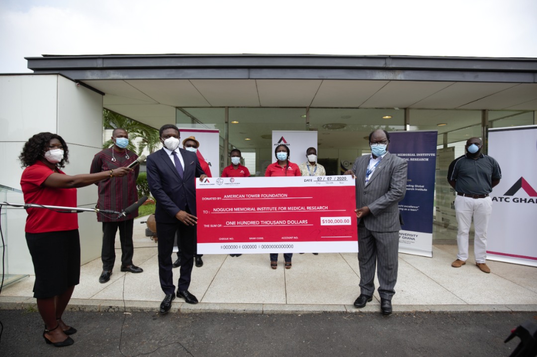 Yahaya Yunusa (left), ATC Ghana Chief Executive Officer, presenting the dummy cheque to Prof. Abraham Annan (right), Director of Noguchi Memorial Institute for Medical Research