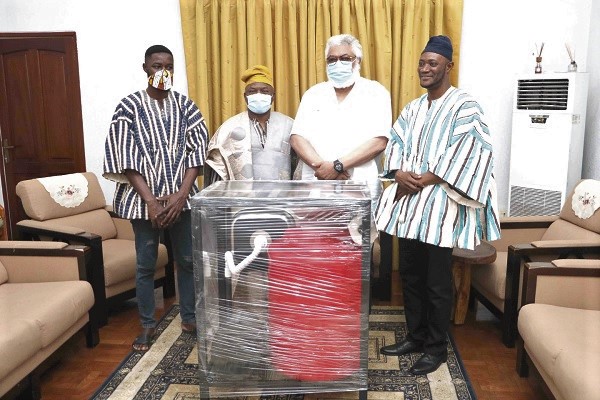 President Rawlings (2nd right) with Mr Alhassan Andani (2nd left) and his nephews 