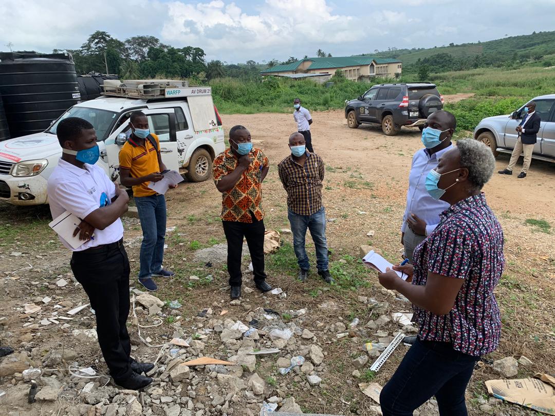 Mr Enock Boadu Amo (left) briefing the PIAC team at the project site