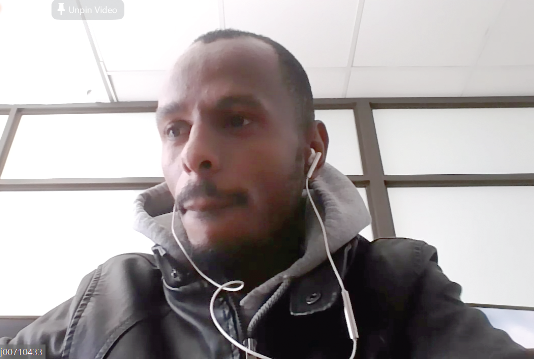 John Mwasi addressing the students via video conferencing from Windhoek, Namibia 