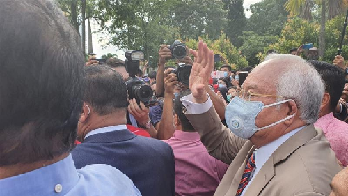 Malaysia's former Prime Minister Najib Razak arrives at court on Tuesday morning. A judge found him guilty on all seven counts [Ted Regencia/Al Jazeera] 