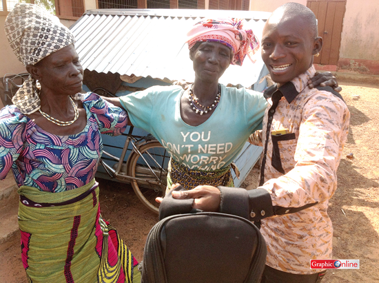 Flashback: Our reporter, Maxwell Adombila Akalaare, shares an infectious smile with some of the women at the Gambaga Witches Camp in 2014