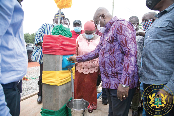 President  Akufo-Addo turning on the tap to officially inaugurate the Nalerigu water system. 