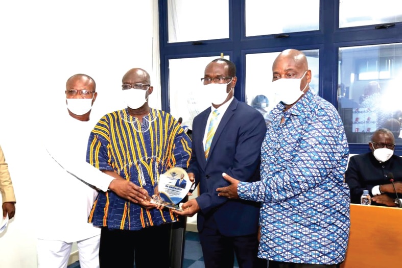 Mr Joseph Kofi Adda (2nd left) presenting a shield to Ing Simon Allotey (2nd right). Those with them are Air Cdre. Rexford Acquah (retd), (right), Chairman, Governing Board GCAA, and Mr Addulai Alhassan (left), outgoing Deputy Director-General, Finance and Administration of the GCAA