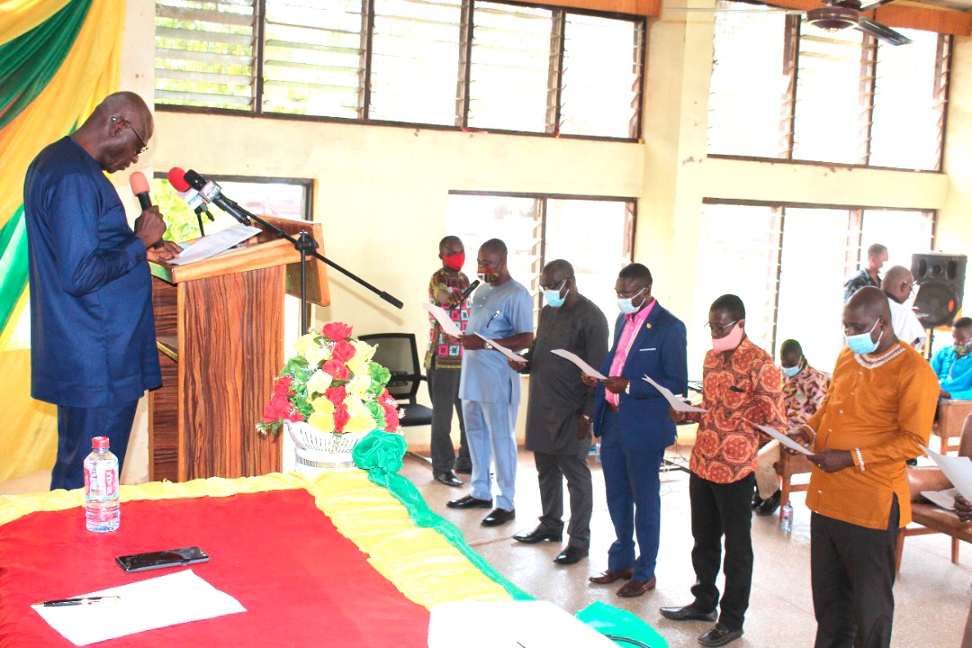 Mr Adjei Boateng (left) swearing in members of the Regional Spatial Planning Committee