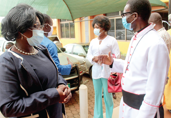 Mrs Justina Owusu Banahene (left), Sunyani Municipal Chief Executive in a chat with some members of the council