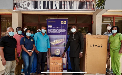Edward Mensah, Corporate Social Responsibility Coordinator of YPWAL (middle-left) at the handover of the donated Biological Safety Cabinet at the National Public Health Reference Laboratory at the Korle-Bu Teaching Hospital in Accra.