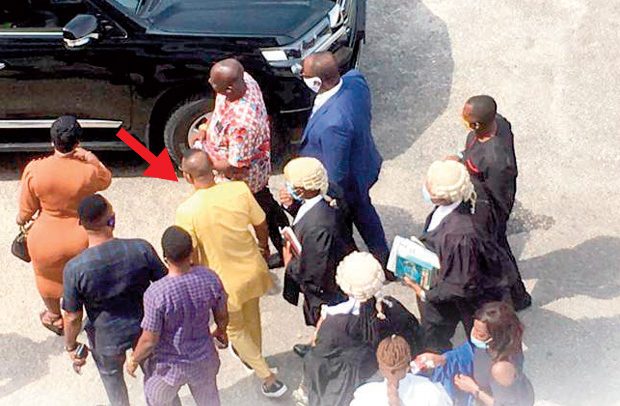 Daniel Obinim (arrowed) approaching his vehicle after Monday’s proceedings. PHOTO CREDIT: Daily Guide