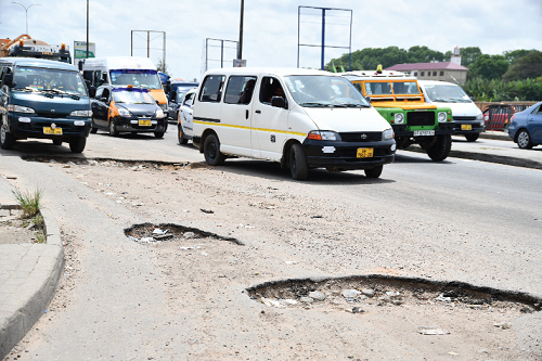 Potholes on the Abossey Okai-Korle Bu road. Picture: EBOW HANSON