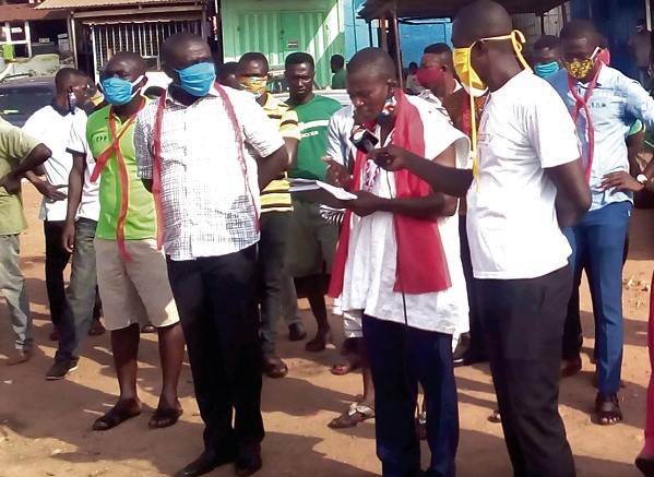 Mr Michael Effah (middle) addressing the media