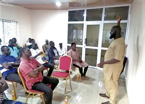 Mr Nurudeen (right) addressing some of the youth