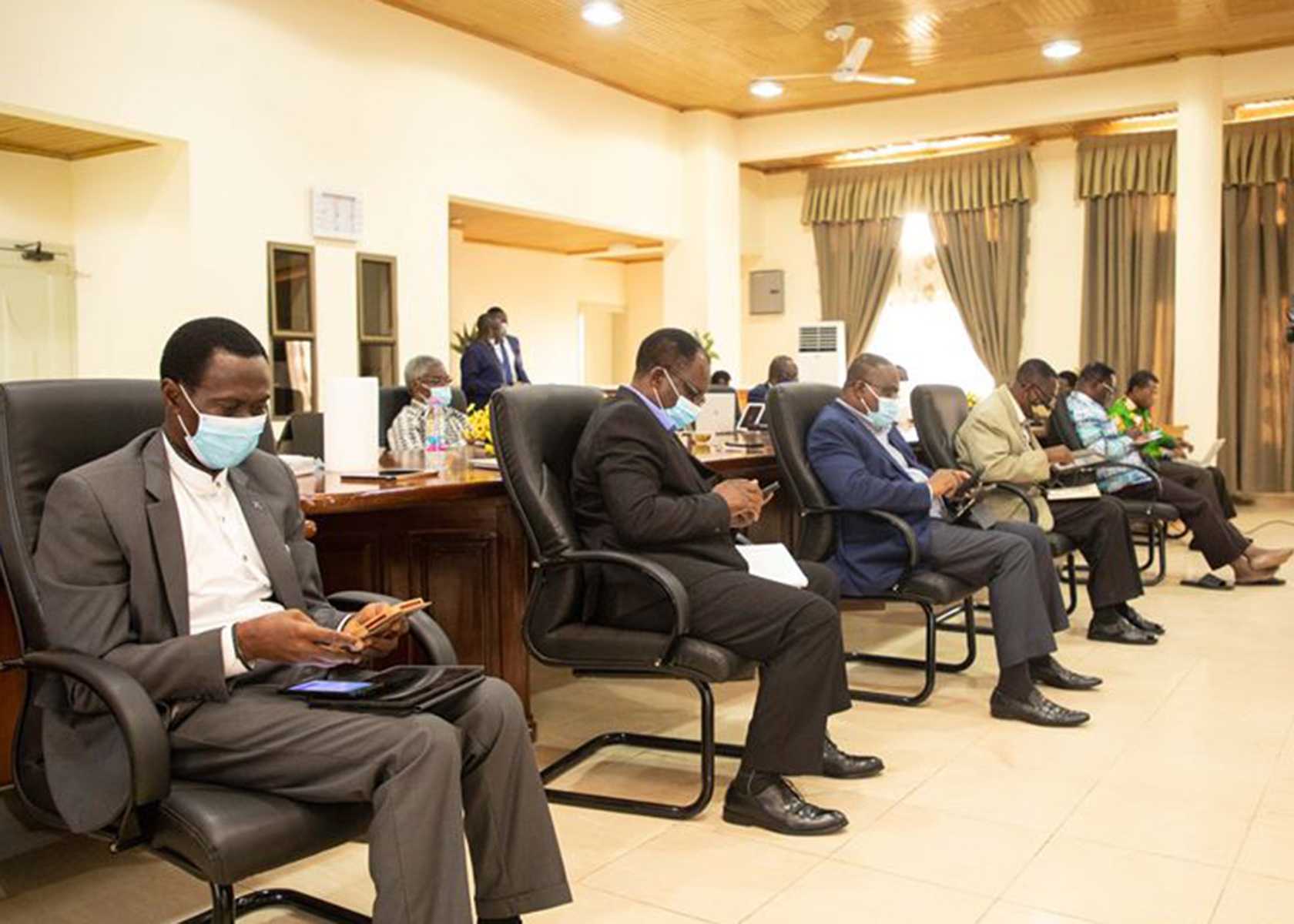 Some Apostles of The Church of Pentecost casting their vote using their phones during the electronic voting to elect its Executive Council members. Inset: Real time dashboard displaying the results
