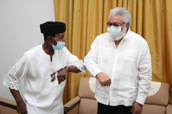  Former President Rawlings and ex-private Hammond exchanging elbow greetings