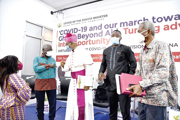Mr Yaw Osafo-Maafo (left) interacting with Bishop Charles Palmer Buckle after the forum. Also in the picture are Mr Kwame Pianim (right) and Mr Isaac Jay Hyde (2nd right). Picture: EBOW HANSON