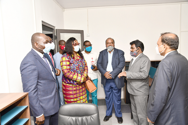 Mr K.V.S. Nathan (2nd right), the CEO of Techmaaxx, conducting dignitaries round facilities at the Graphic Courier Service during the launch. Picture: EBOW HANSON