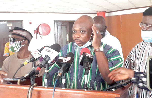 Mr James Agalga (middle, the Ranking Member on Defence and Interior, addressing the press. with him are some Minority MPs