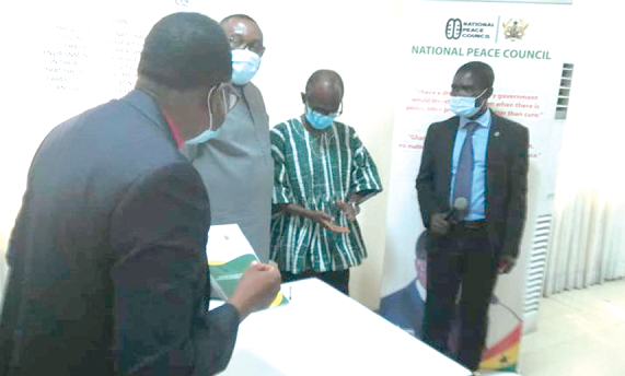 Most Rev. Prof.  Asante (back facing camera) with Mr Ofosu Ampofo (2nd left) and Mr Asiedu Nketia (3rd left) during the ceremony in Accra yesterday