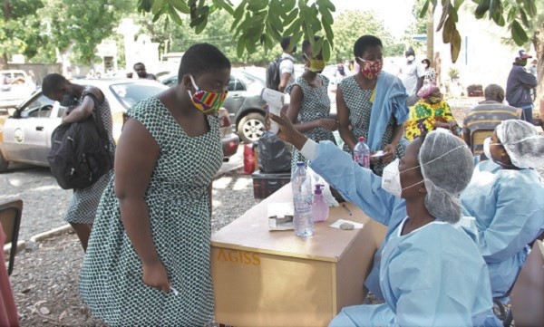A student of the Accra Girls’ Senior High School being screened at the school. Picture: EDNA SALVO-KOTEY