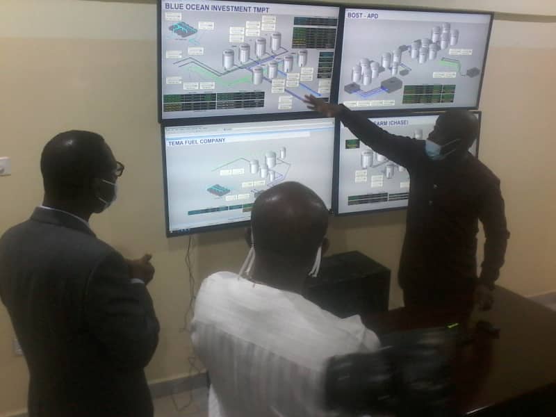 Mr John Ekow Mensah (right), Head of Operations, SML, explaining the processes involved in its operations to the Minister of Finance, Mr Ken Ofori-Atta. With them is Mr Christian Sottie (left), General Manager, SML