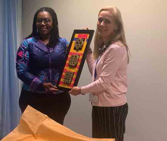 Mrs. Ursula Owusu-Ekuful presenting a gift to Md. Kitty Van de Heijden