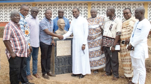 Mr Stephen Antwi (4th left) symbolically handing over the Burgess Hall (inset) to Rev. Fr Owusu Sekyere, while some of the year group members look on