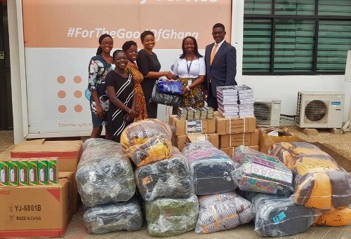 Ms Agnes Ntibanyurwa  (2nd right),  Deputy Country Representative  of the UNFPA, presenting the items to Mrs Seun Jooda (3rd left)